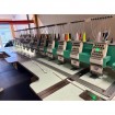 Used Tajima TFSN-912 industrial embroidery machine, 12 heads